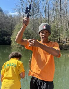 Camper with a fish on the line